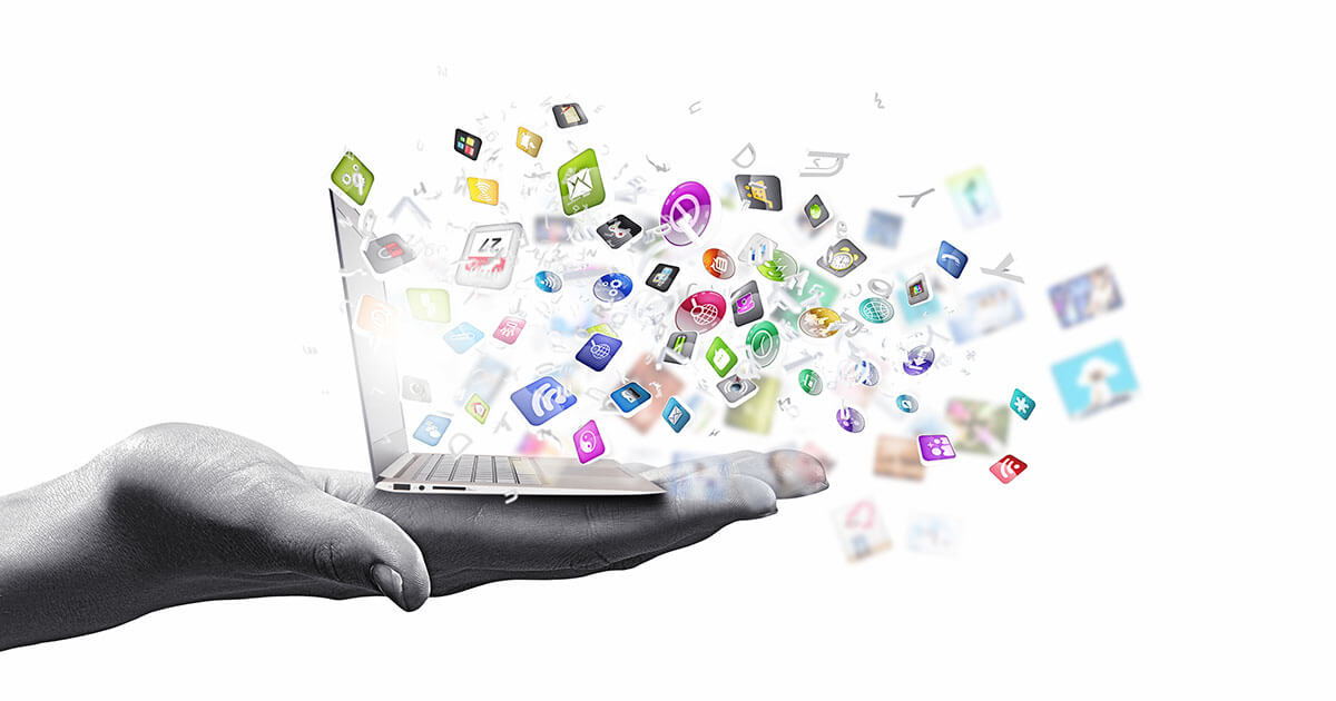 Hand holding laptop with colorful app icons floating out, representing SmartStack Tools software suite