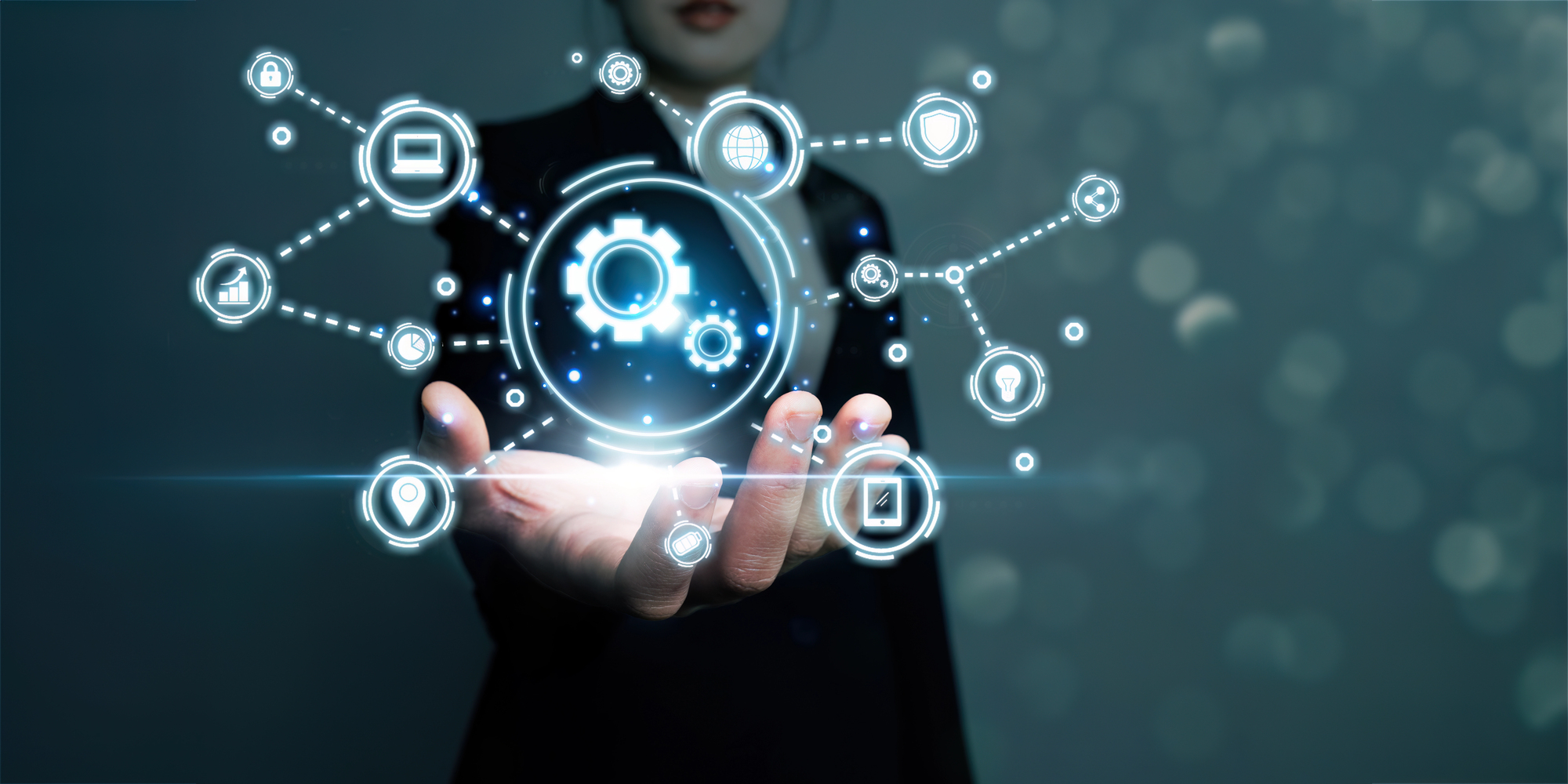 A person holding a glowing network of digital icons